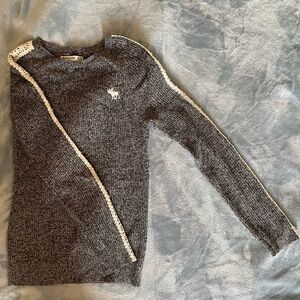 Black & white kids sweater with white detailing.